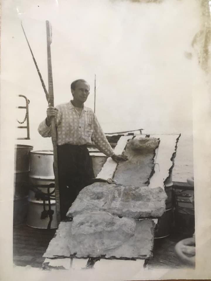 Drinan stands next to his makeshift raft after being rescued