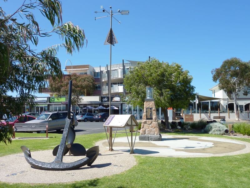 Commemorative cairn, sign and anchor at San Remo