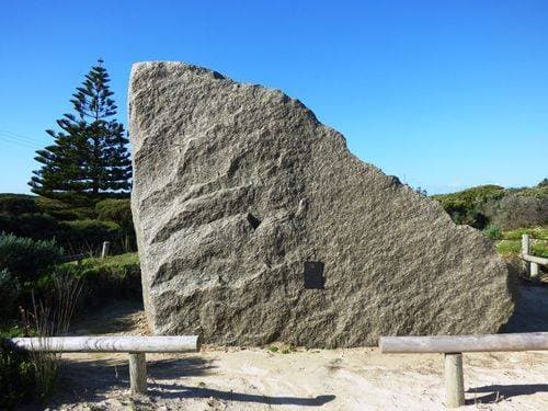 The large rock with a plaque dedicated to lost fishers.